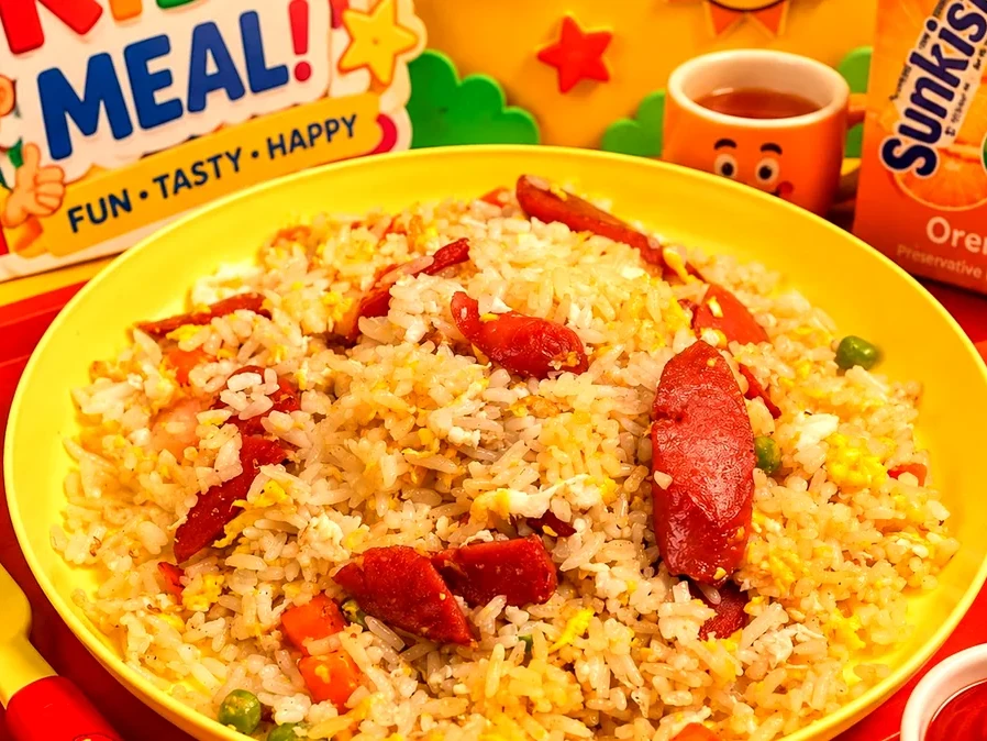 Kids Fried Rice with sausage, egg, peas and carrots served with Sunkist orange juice