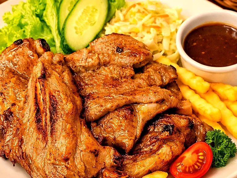 Grilled lamb chop with black pepper sauce, crinkle fries and fresh salad